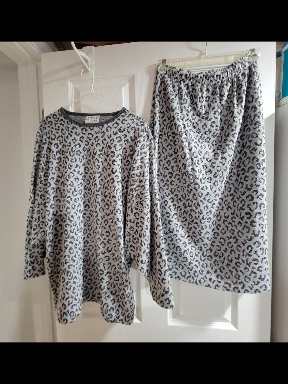 Comfy two-piece set. Leopard print. Top is size Medium, skirt is size Large.